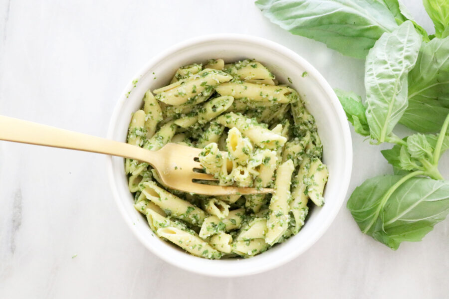 Bowl of Pasta Noodles Mixed with Dairy-Free Pesto with Fresh Basil