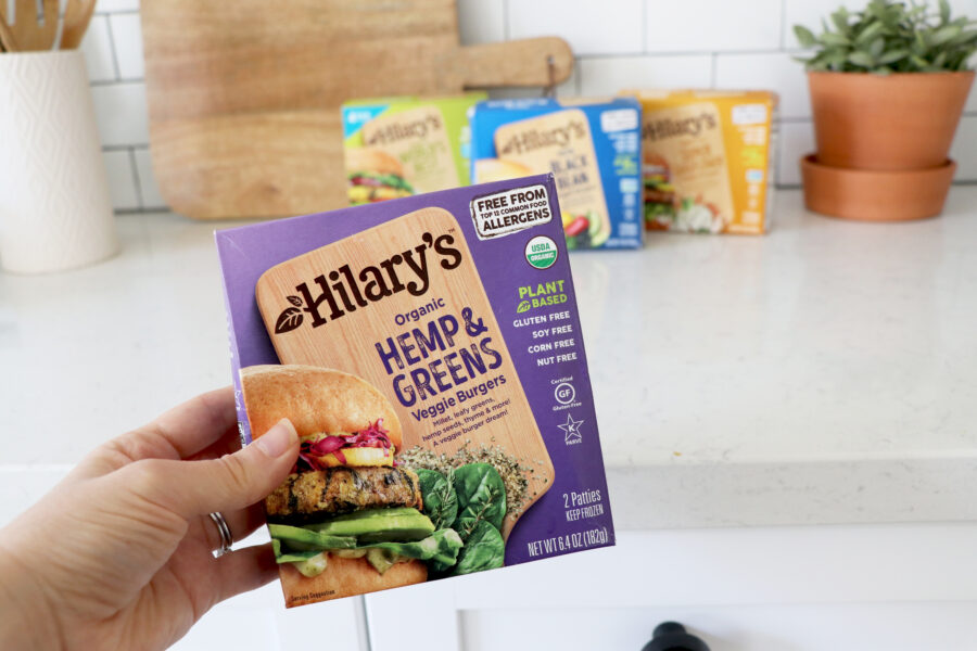 Holding up box of Hilary's veggie burgers.