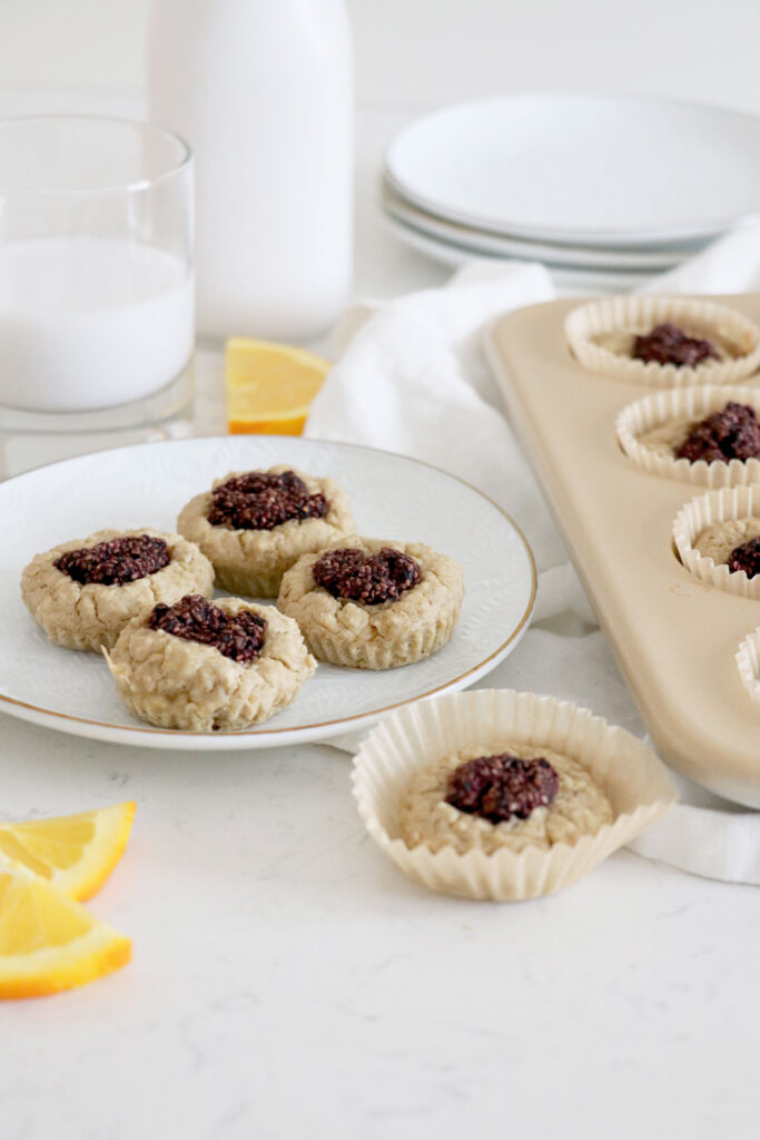 Plate of muffins and muffin tin on the right side.