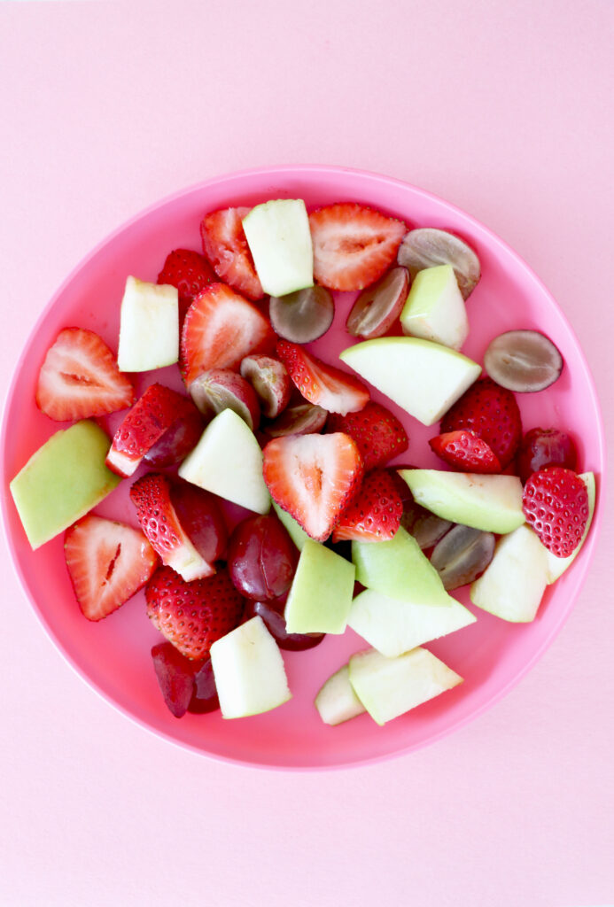 Fruit salad on pink plate